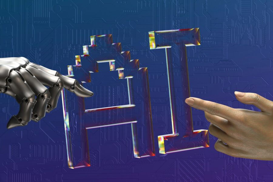 Glass AI letters on a blue circuit background, touched by a robot hand and a human hand